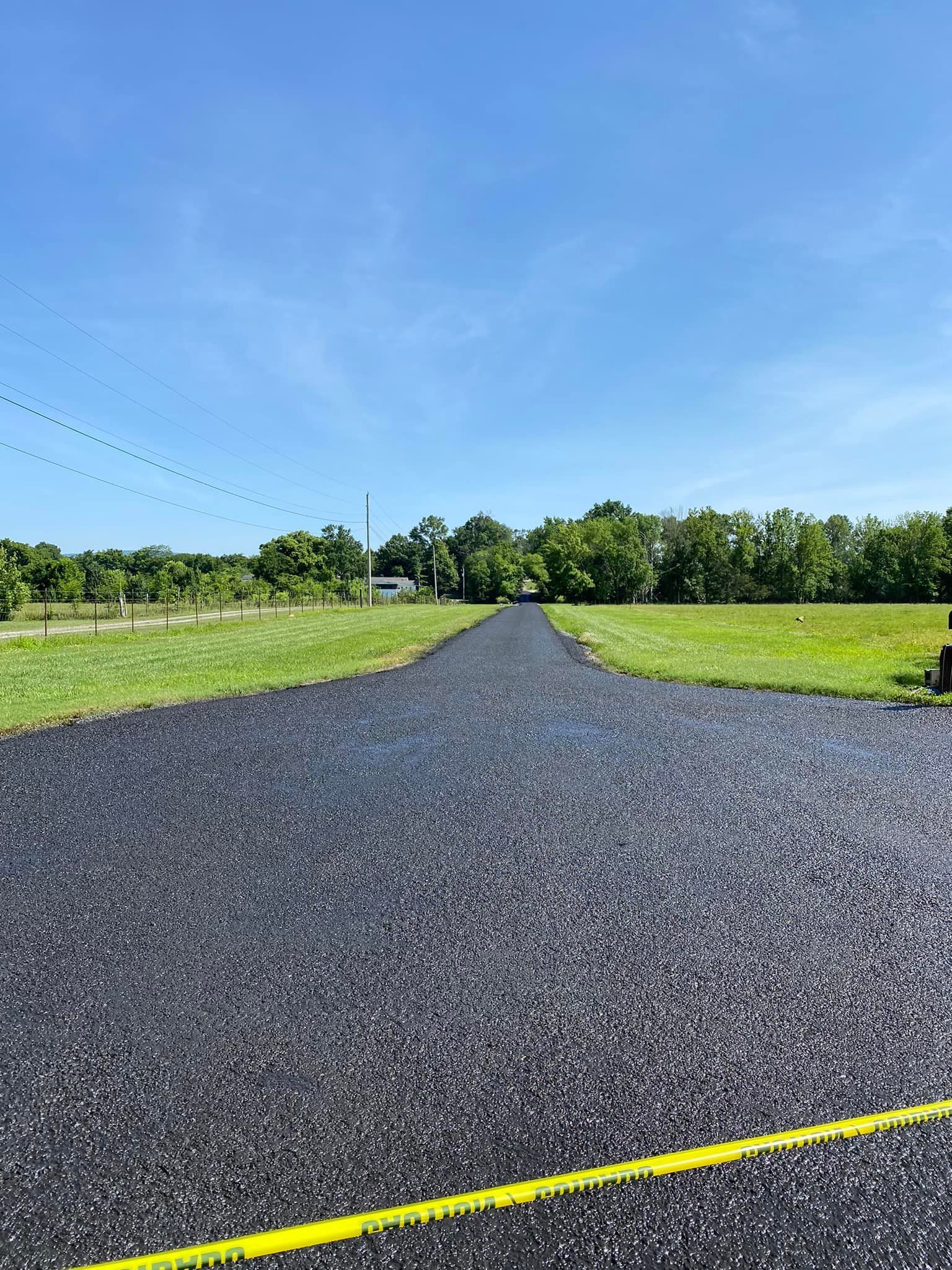 Freshly seal-coated  residential driveway in Whitwell, TN