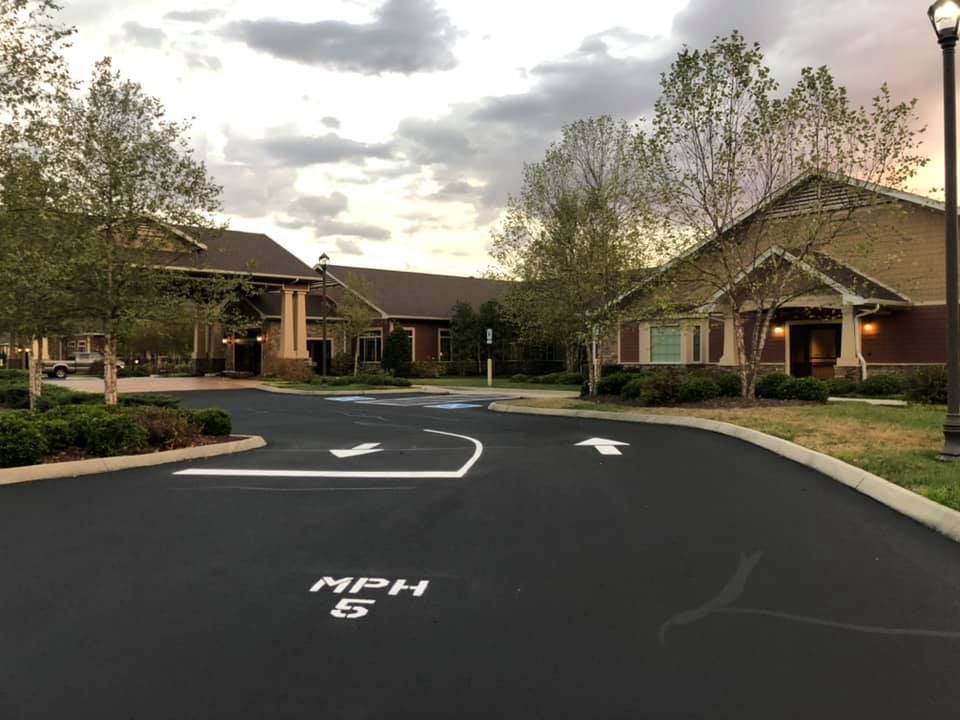 Newly asphalted parking lot with fresh paint lines. 