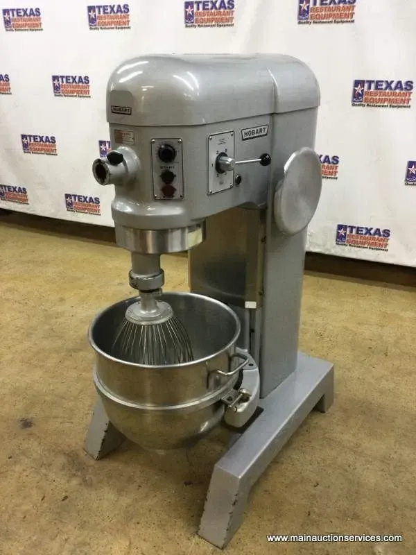 Stainless steel Bari brand commercial oven with pizza being put in