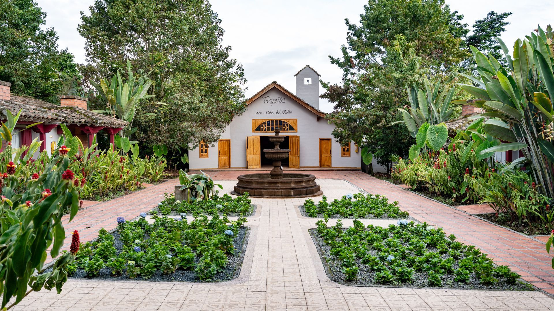 Chapel at Hotel Termales El Otoño surrounded by gardens and a central fountain, for ceremonies and weddings in Manizales