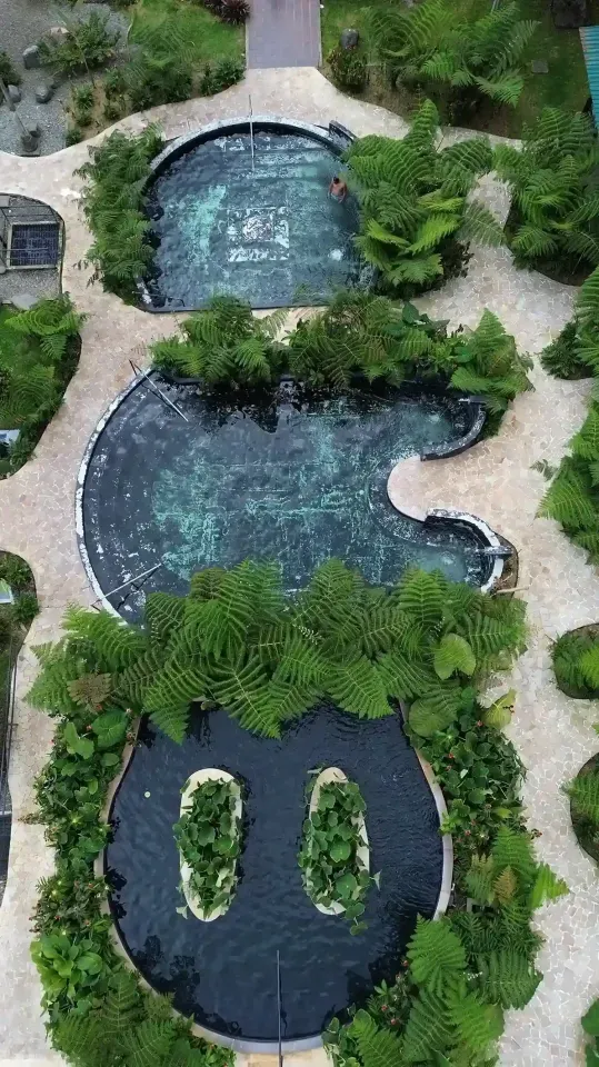 Thermal pools at Termales El Otoño, a Colombian hot springs hotel surrounded by gardens and mountains.
