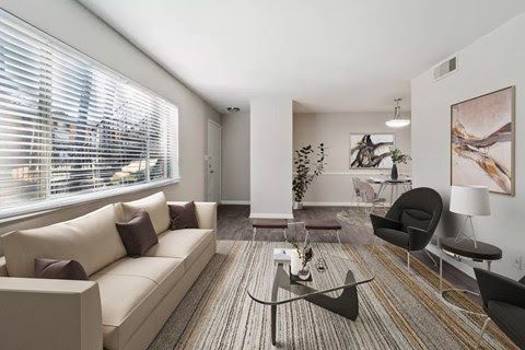 Rendering of a living room, showing plenty of natural lighting