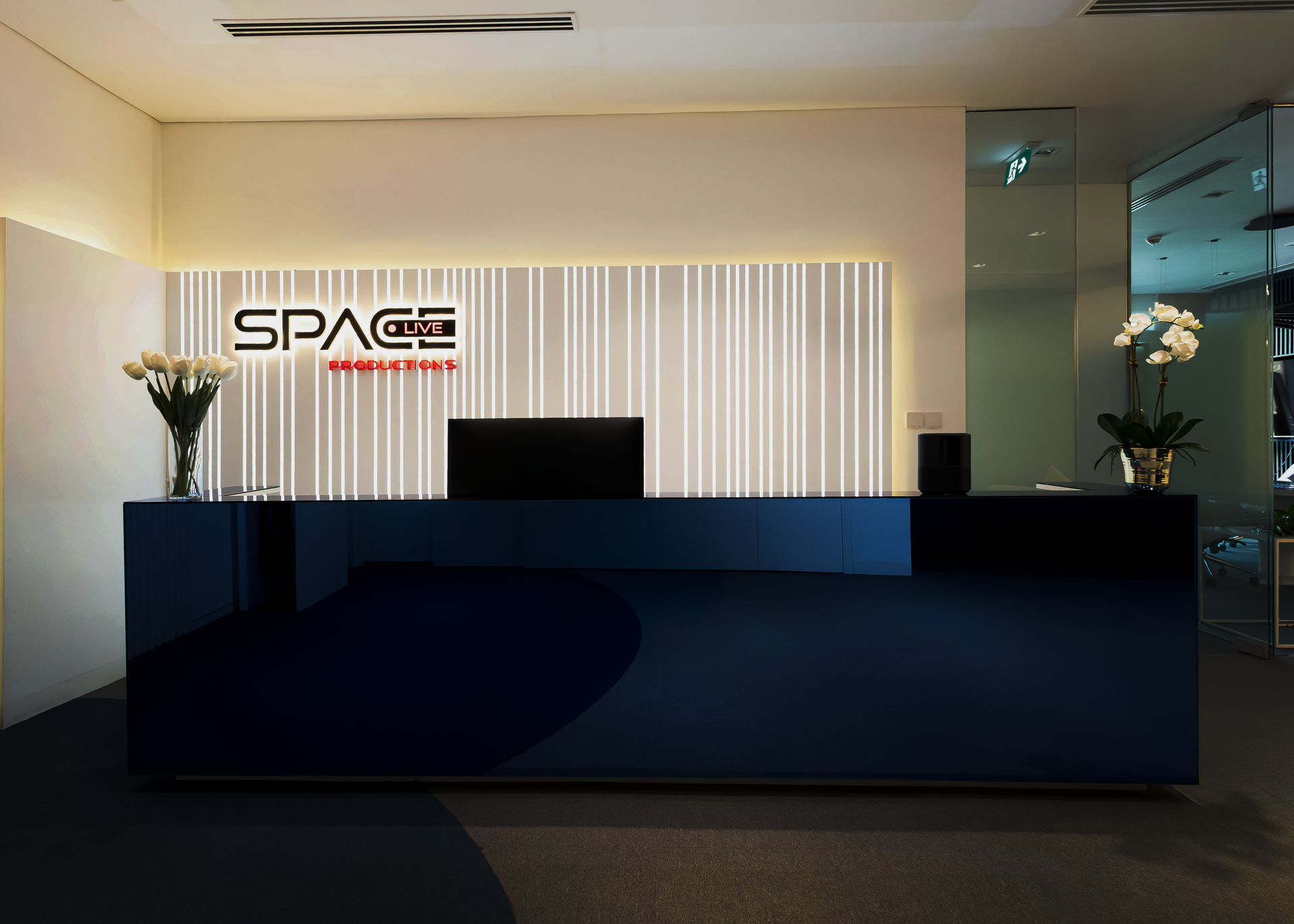 A reception desk with a sign that says space on it