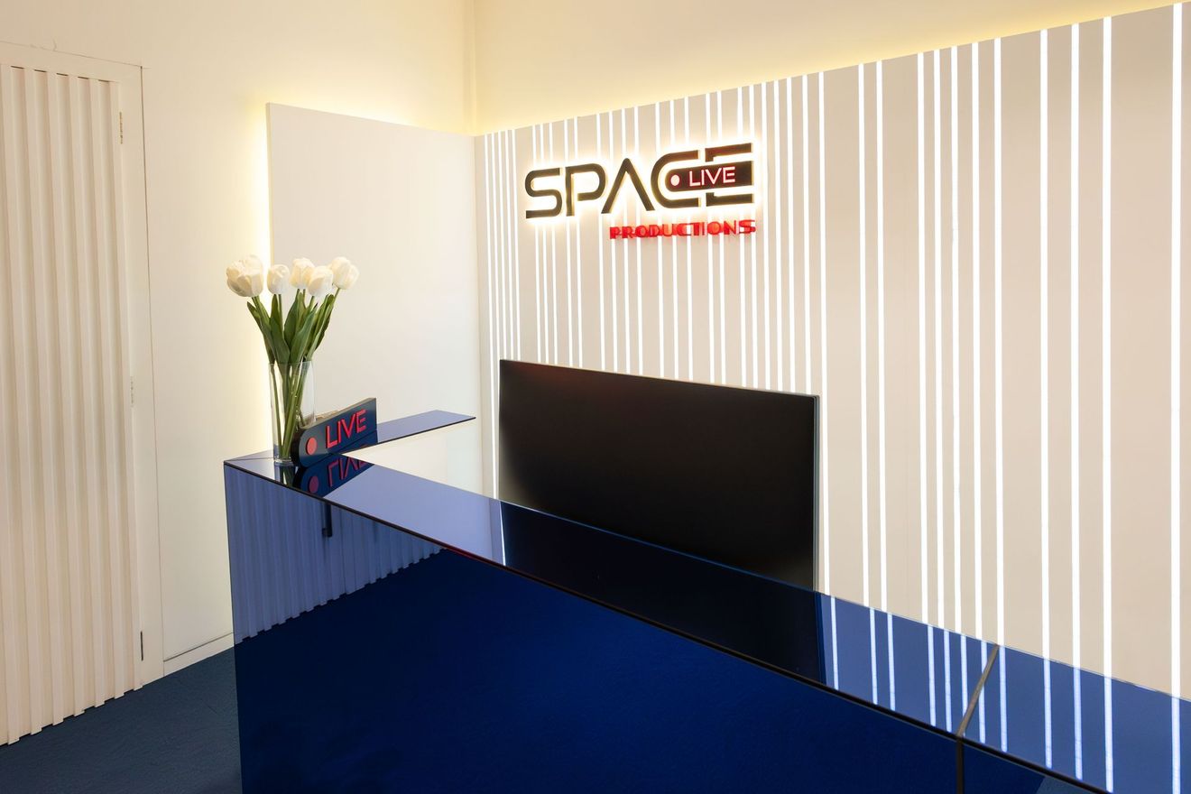 A reception area with a sign that says space club