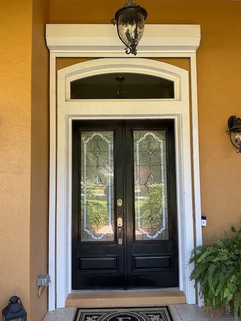 The front door of a house with a lantern on top of it
