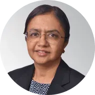 A woman wearing glasses and a black jacket is in a circle.
