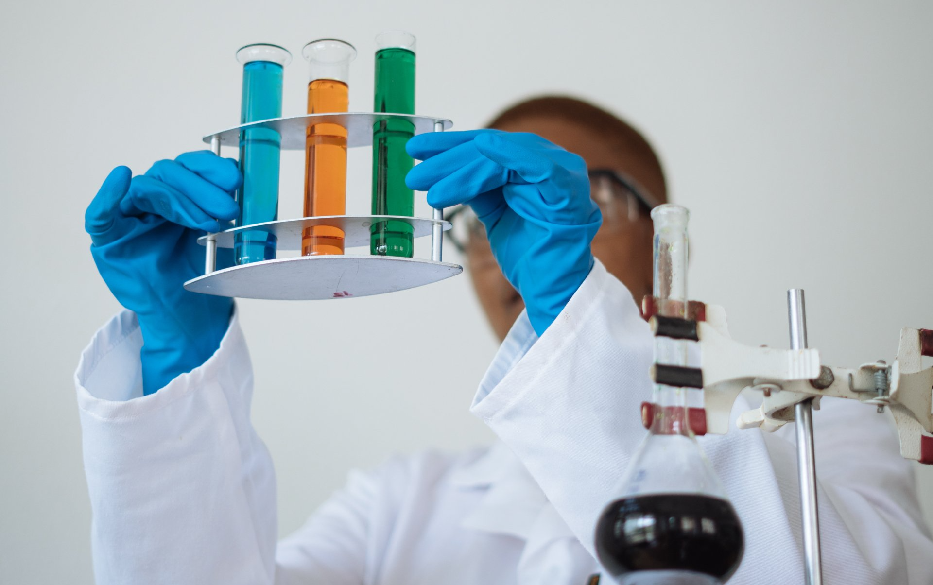lab worker looking at samples of liquid