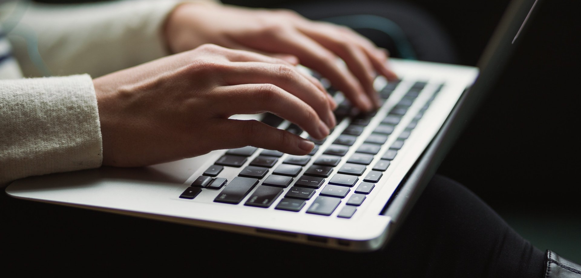 writing on computer keyboard