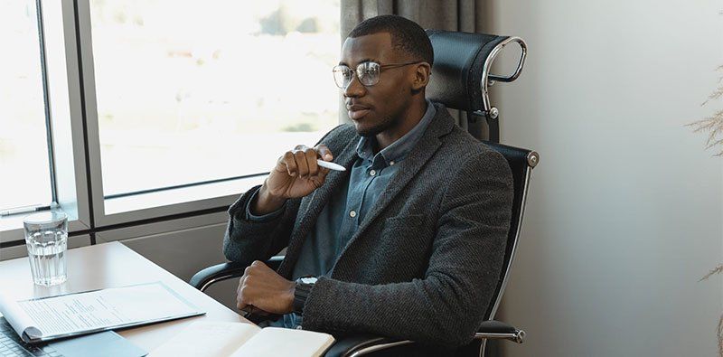 man thinking about writing