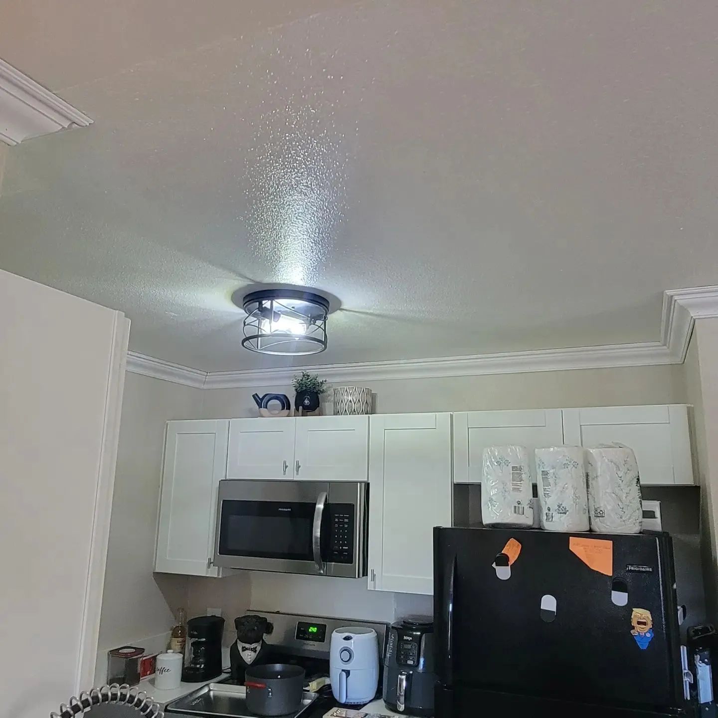Sandy surface with wave-like patterns and long shadows, bathed in warm light.
