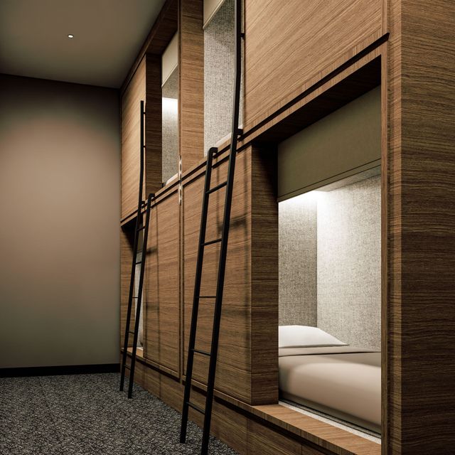 A cosy, modern sleeping nook with single-sized bed dressed in 400 thread-count sateen cotton linens.