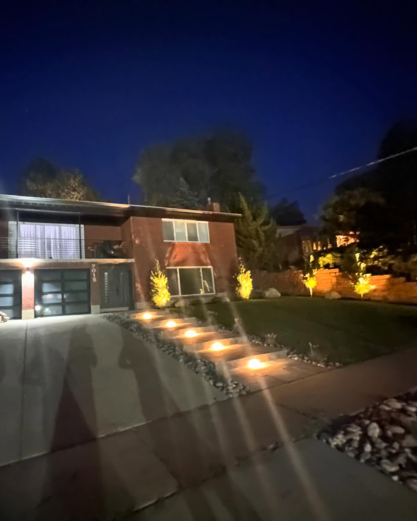 A house is lit up at night with a lot of lights