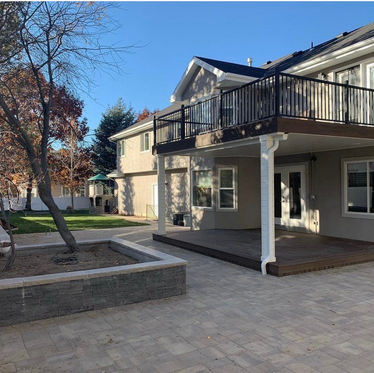 A large house with a balcony and a patio