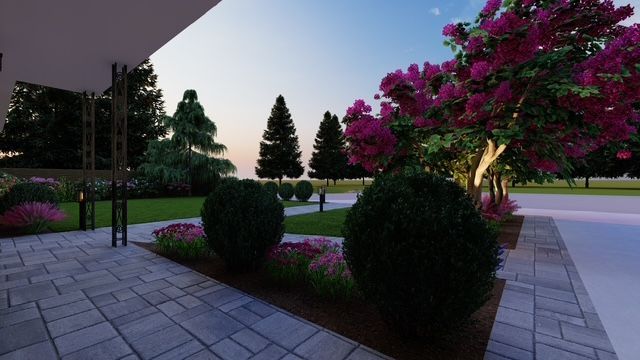 A stone wall along a sidewalk with trees in the background