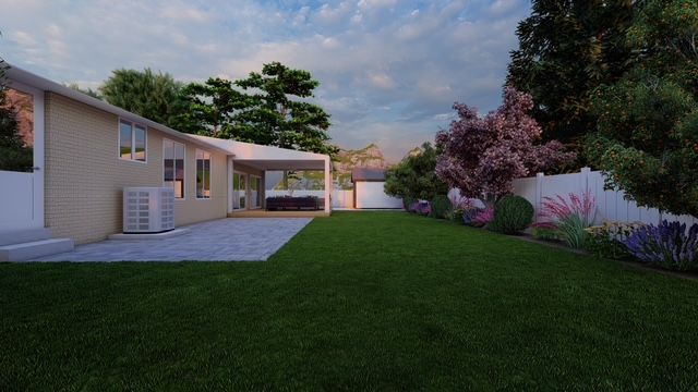 A brick house with two raised beds in front of it