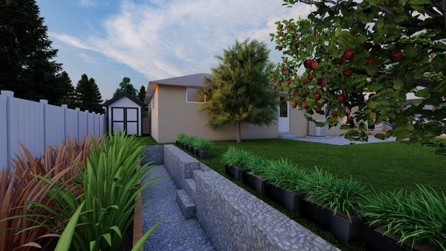 A house with a lot of trees and rocks in front of it.