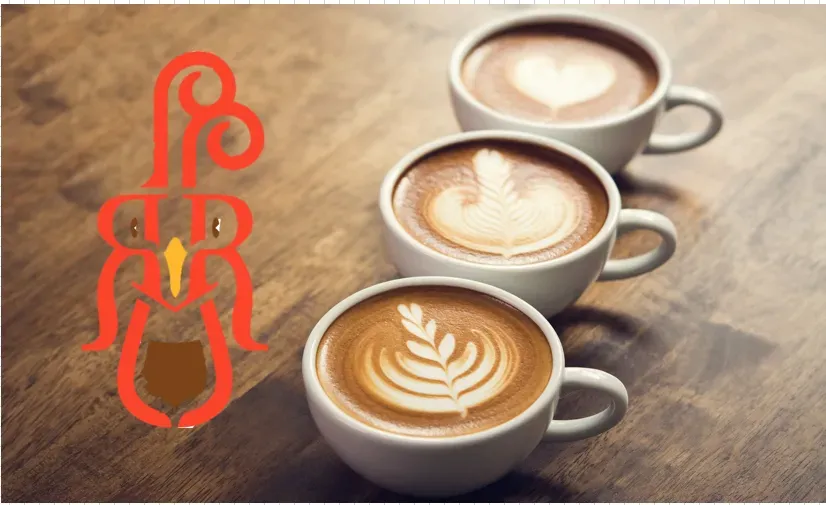 Three cups of coffee are lined up on a wooden table.