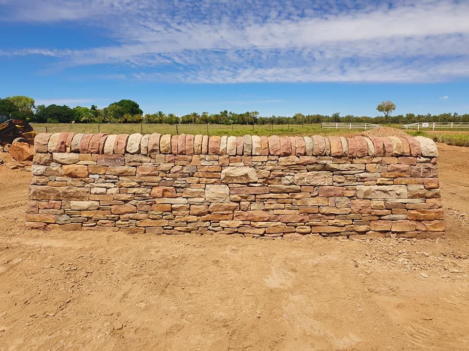 A Stone Wall Featuring Layered, Earthy-toned Masonry — High End Stone Masons in West End, QLD