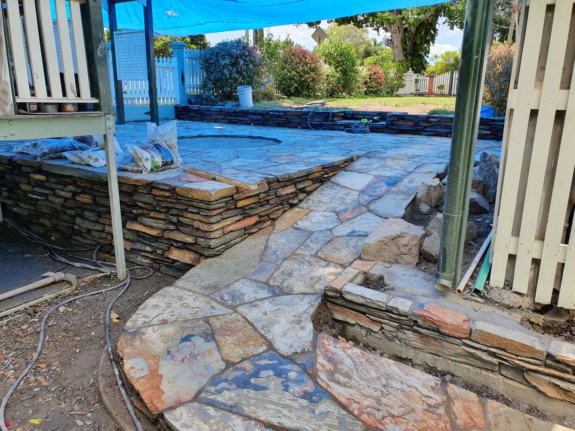 A Stone-paved Path Winds Toward a Raised Stone Platform — High End Stone Masons in West End, QLD