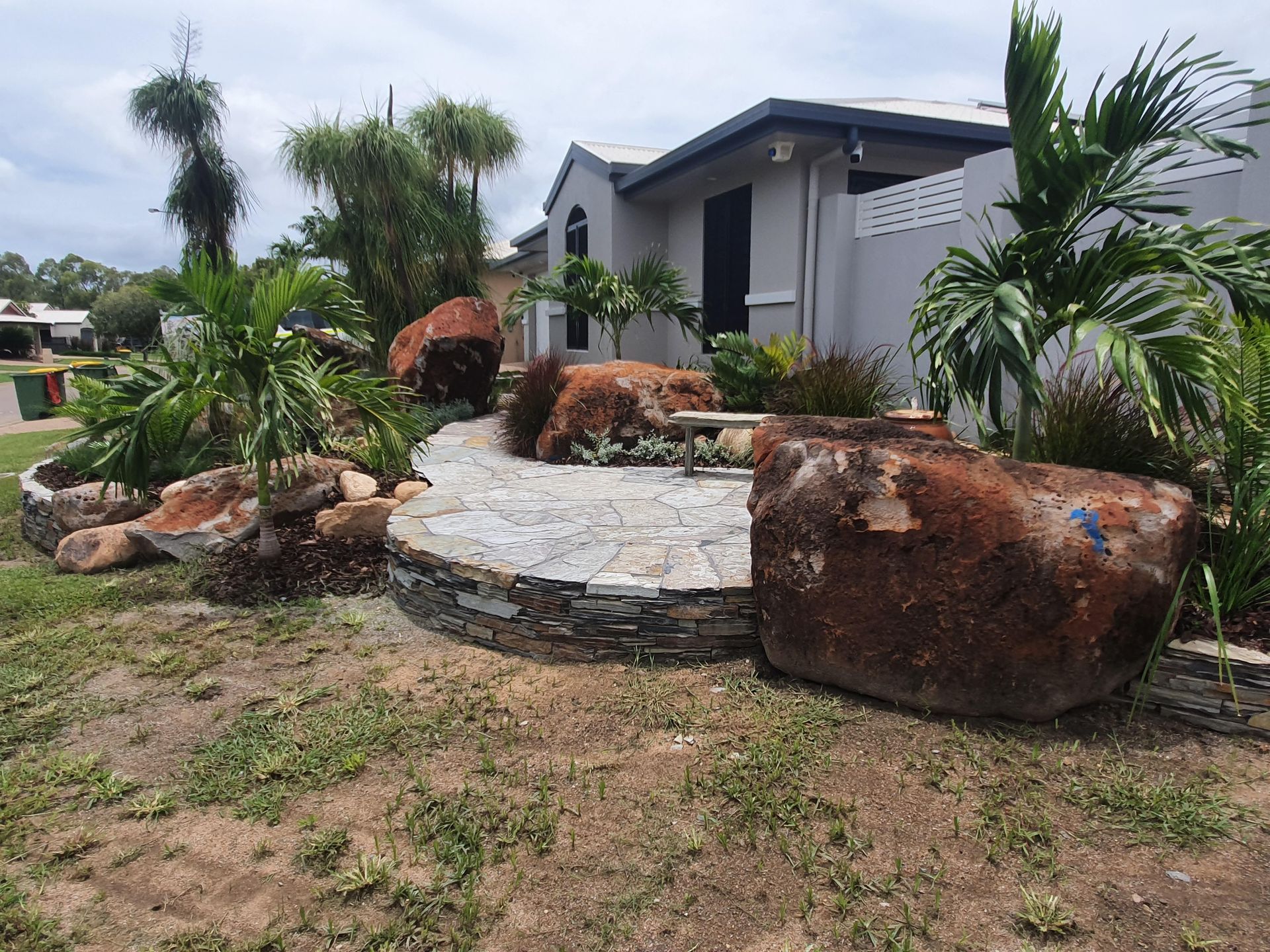 A Stone Retaining Wall Built Between a House — High End Stone Masons in West End, QLD