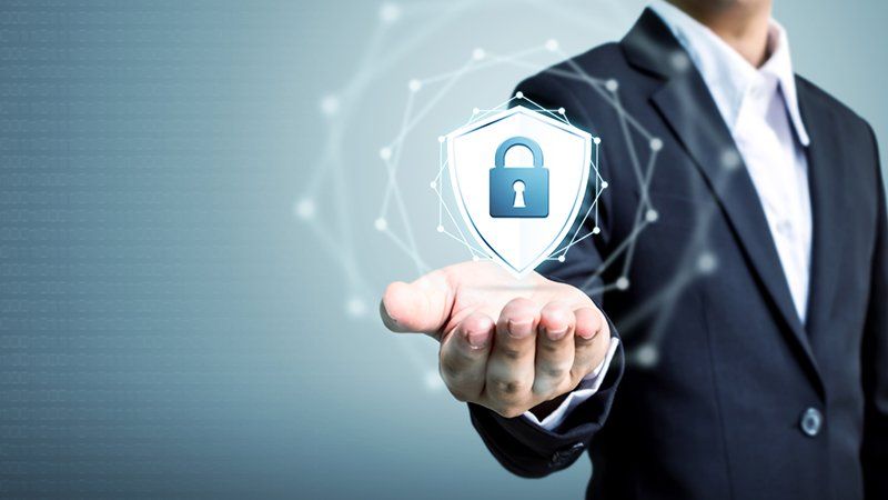 man holding a digital representation of security with a lock inside - asset protection practice area image