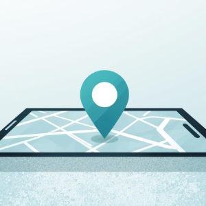 Teal map pin on a folded road map, symbolizing location or navigation