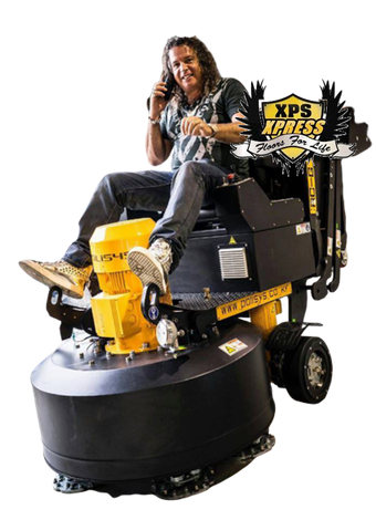 I Make Jewelry You Can Walk On! Man on a yellow-and-black XPS pressure washer ride-on cleaner, sitting outdoors and holding a phone.