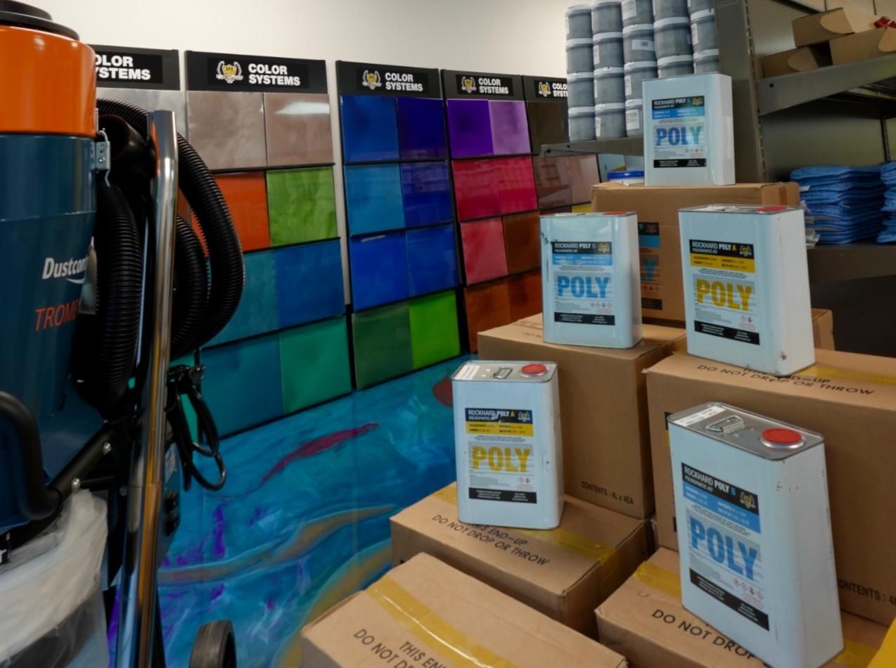 Colorful tiled display with stacked POLY boxes in a store aisle