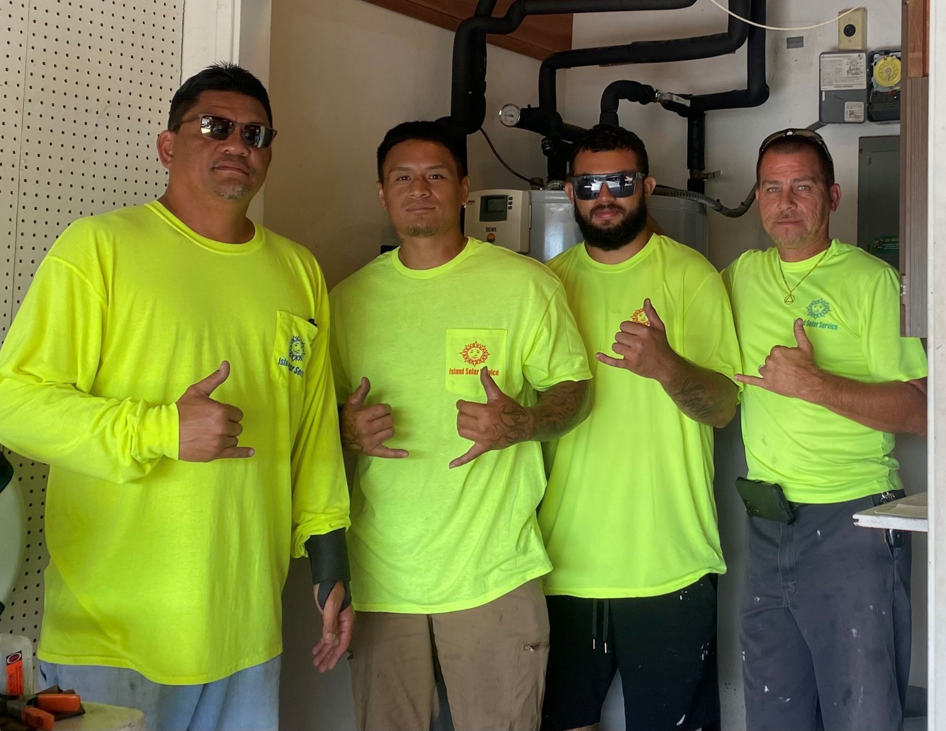 Team members wearing neon workshirts Team members wearing neon workshirts