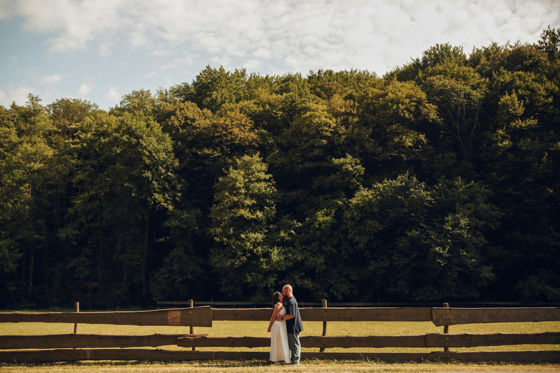 Happy couple kissing on farm