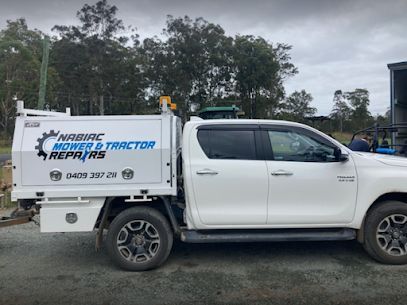 A White Truck With a Box on the Back is Parked on the Side of the Road — Nabiac Mower & Tractor Repairs in Nabiac, NSW