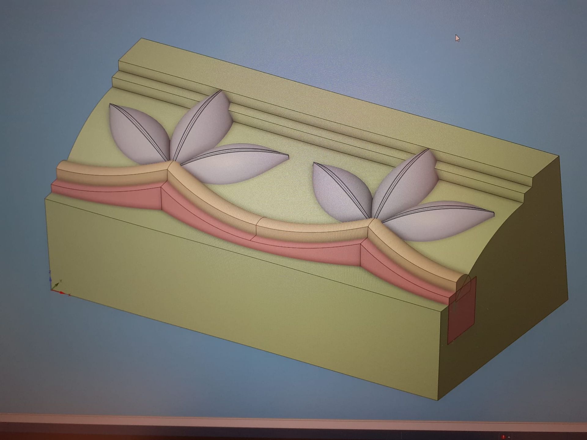 Ein Computerbildschirm zeigt ein 3D-Modell eines Blumendesigns