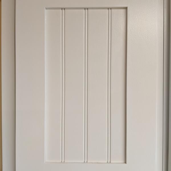 White paneled door with a recessed rectangular center panel