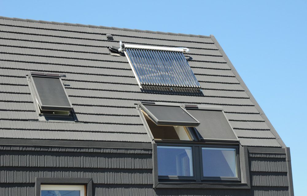 A Roof With Two Windows And A Solar Panel On It — The Woolmen In Byron Bay, NSW