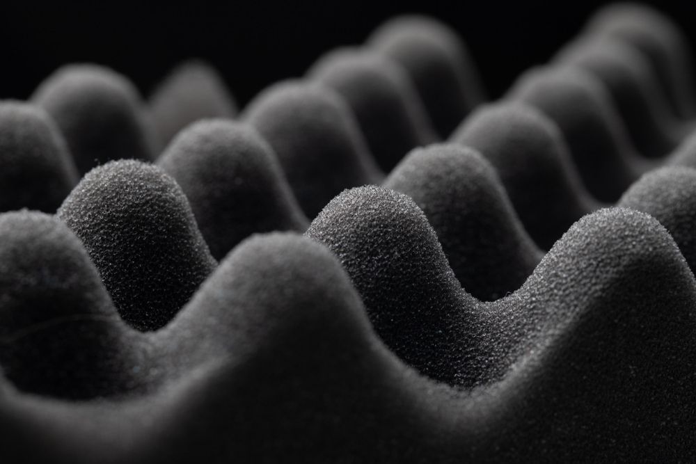 A Close Up Of A Black Foam Cushion On A Black Background — The Woolmen In Byron Bay, NSW
