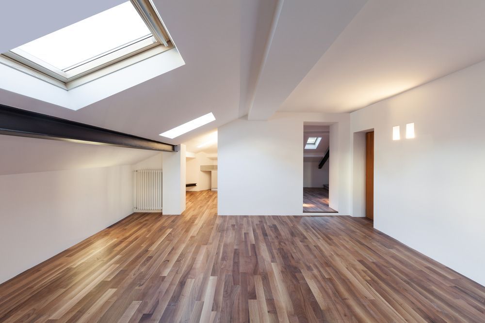An Empty Room With Hardwood Floors And A Skylight In The Ceiling — The Woolmen In Alstonville, NSW