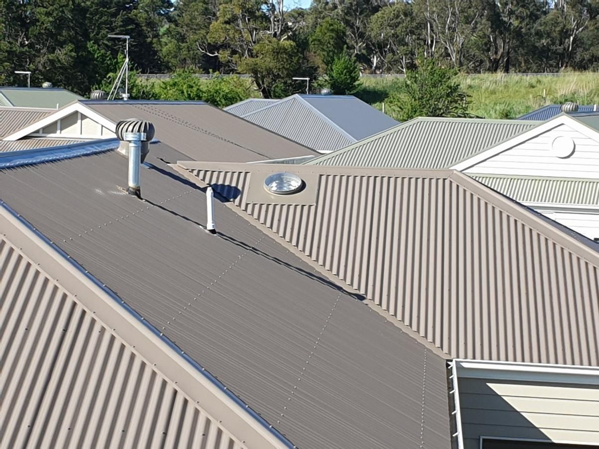 The Roof Of A House Has A Chimney And Skylight  On It — The Woolmen In Murwillumbah, NSW