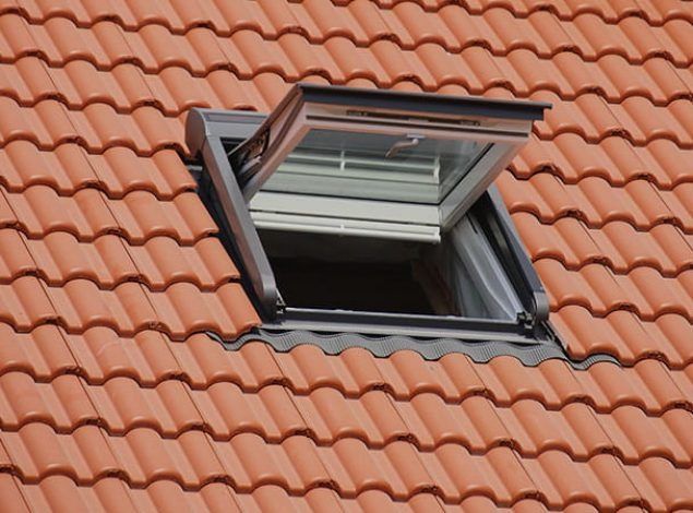 A Skylight On A Red Tiled Roof With The Window Open — The Woolmen In Alstonville, NSW