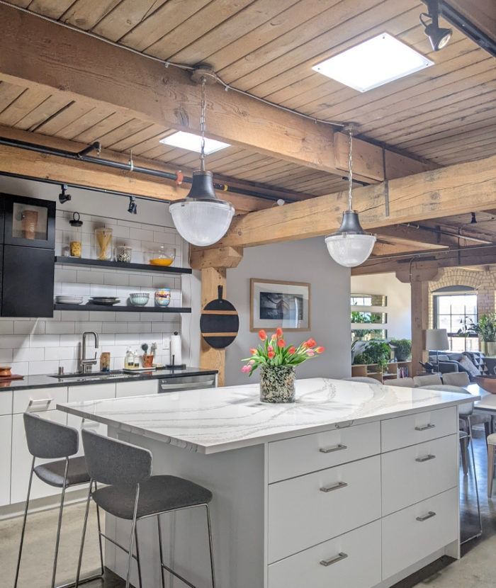 A Kitchen With A Large Island And A Vase Of Flowers On It — The Woolmen In Alstonville, NSW