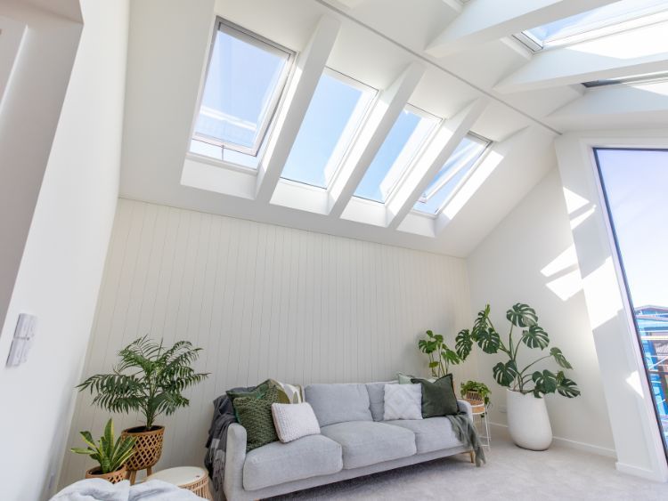 A Living Room With A Couch And Skylights On The Ceiling — The Woolmen In Alstonville, NSW