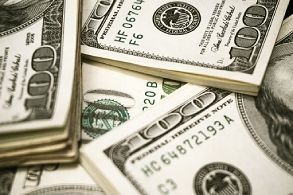 Stacks of U.S. dollar bills arranged in a close-up view