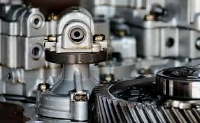 Close-up of metal gears and machine parts in an industrial mechanism