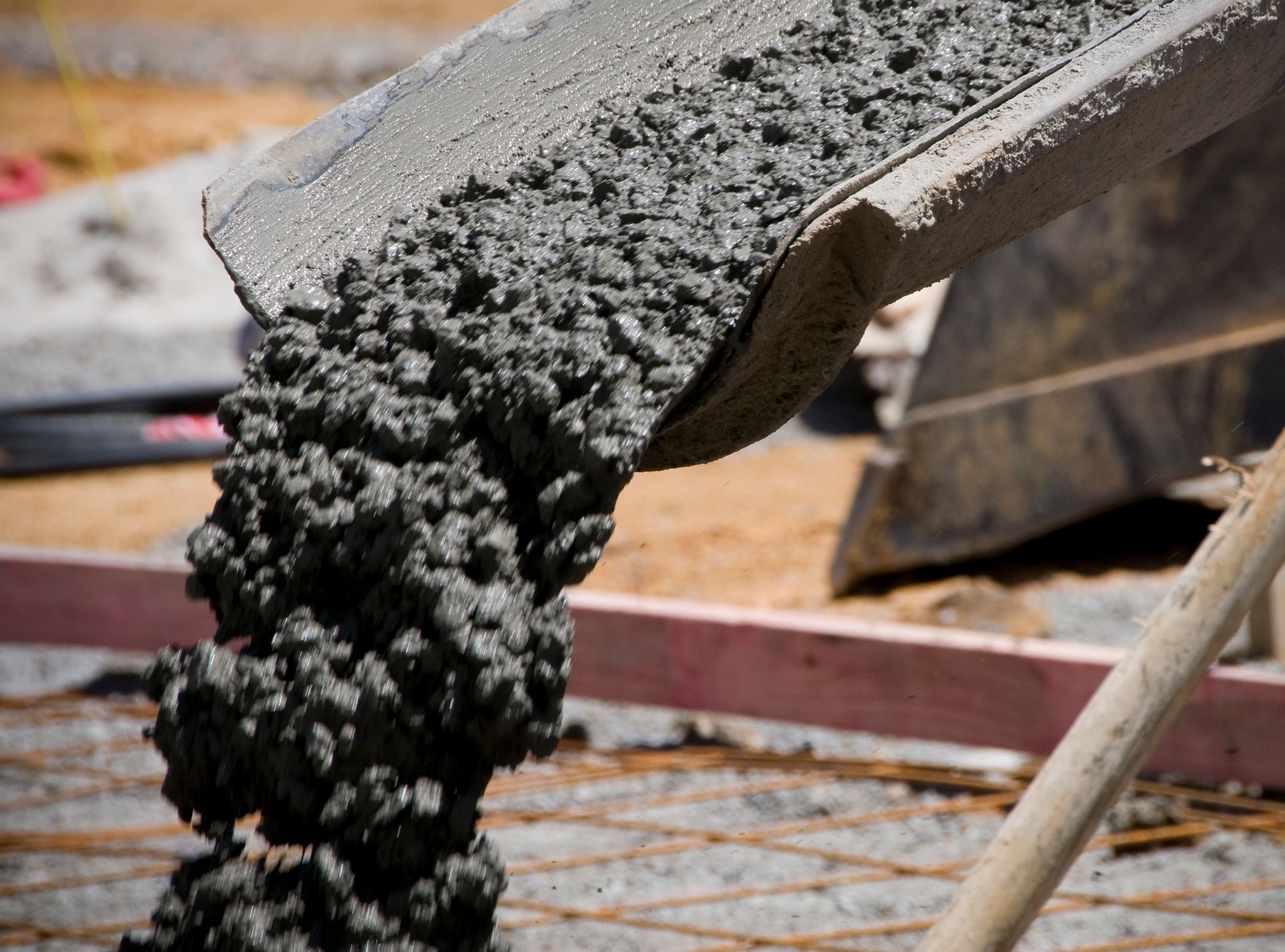 Norton Civil Construction in Tucker, GA, pours concrete from a mixer onto a slab, serving as your tr
