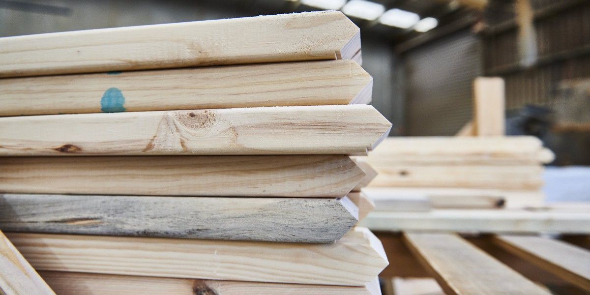 Timber framing supplies including beams and joists.