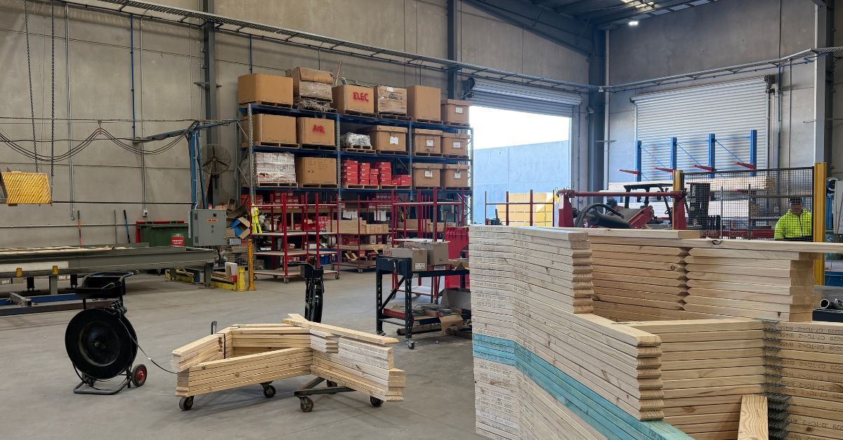 Trussfab factory with timber framing components prepared for roof truss and wall frame projects