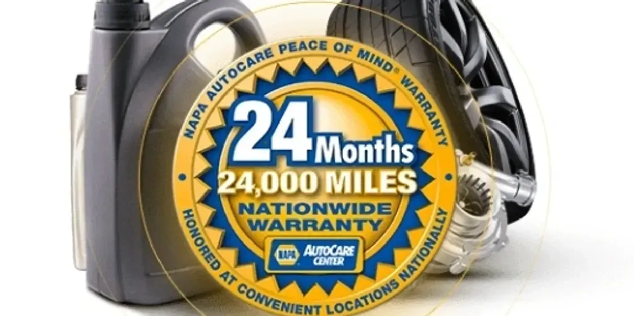 NAPA Autocare warranty: 24-month/24,000-mile nationwide warranty, displayed over oil jug, tire, and car part. | Ashten's Total Auto Care
