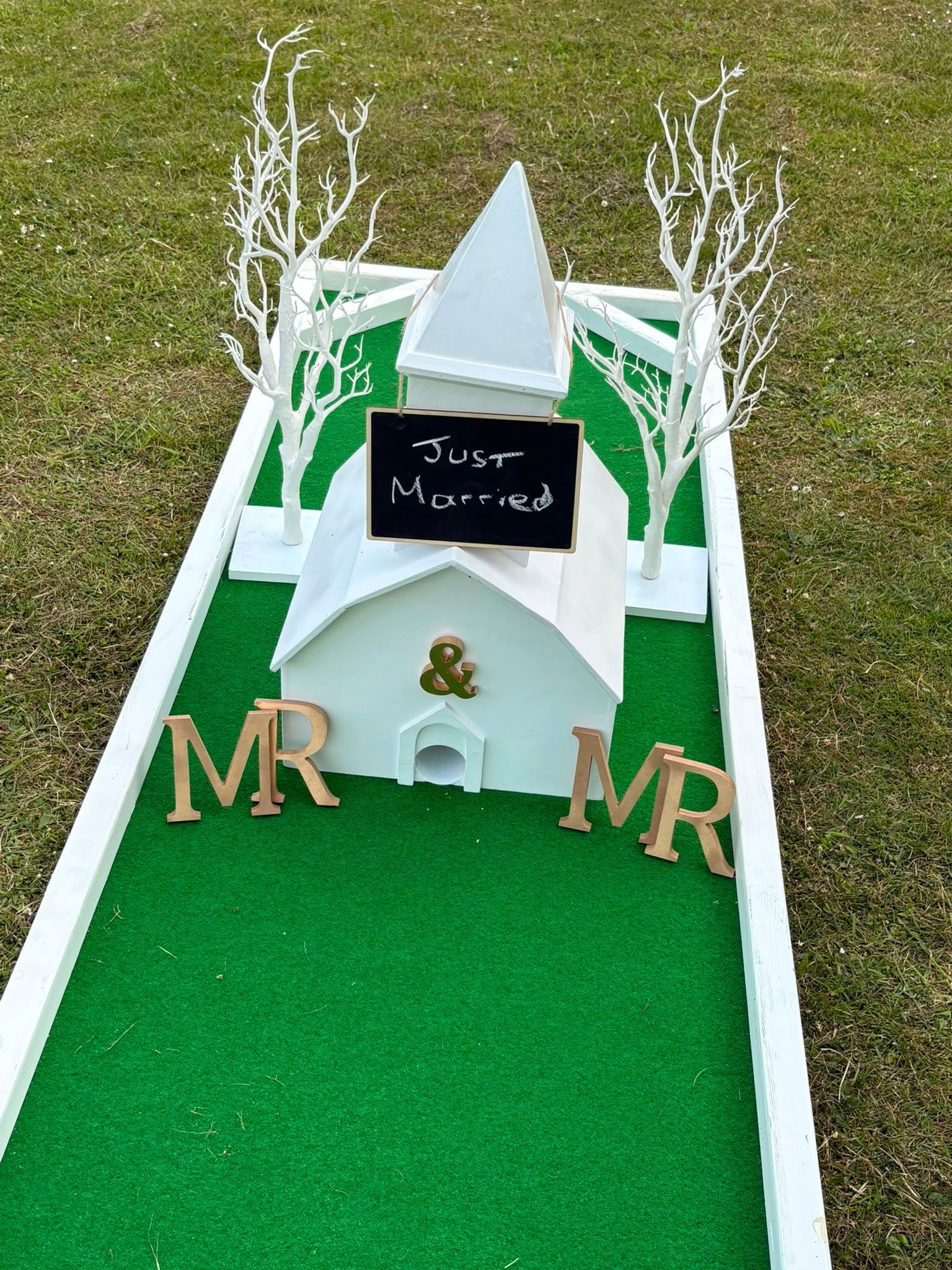 Overhead detail of putters, golf balls and scorecard