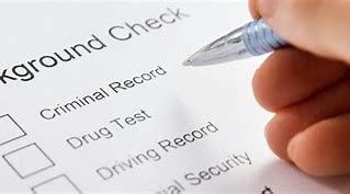 A person is filling out a ground check form with a pen.
