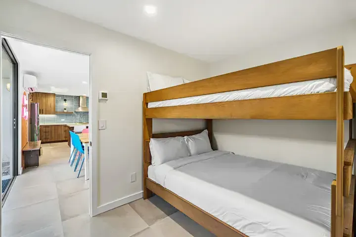 There is a bunk bed in the middle of the room.
