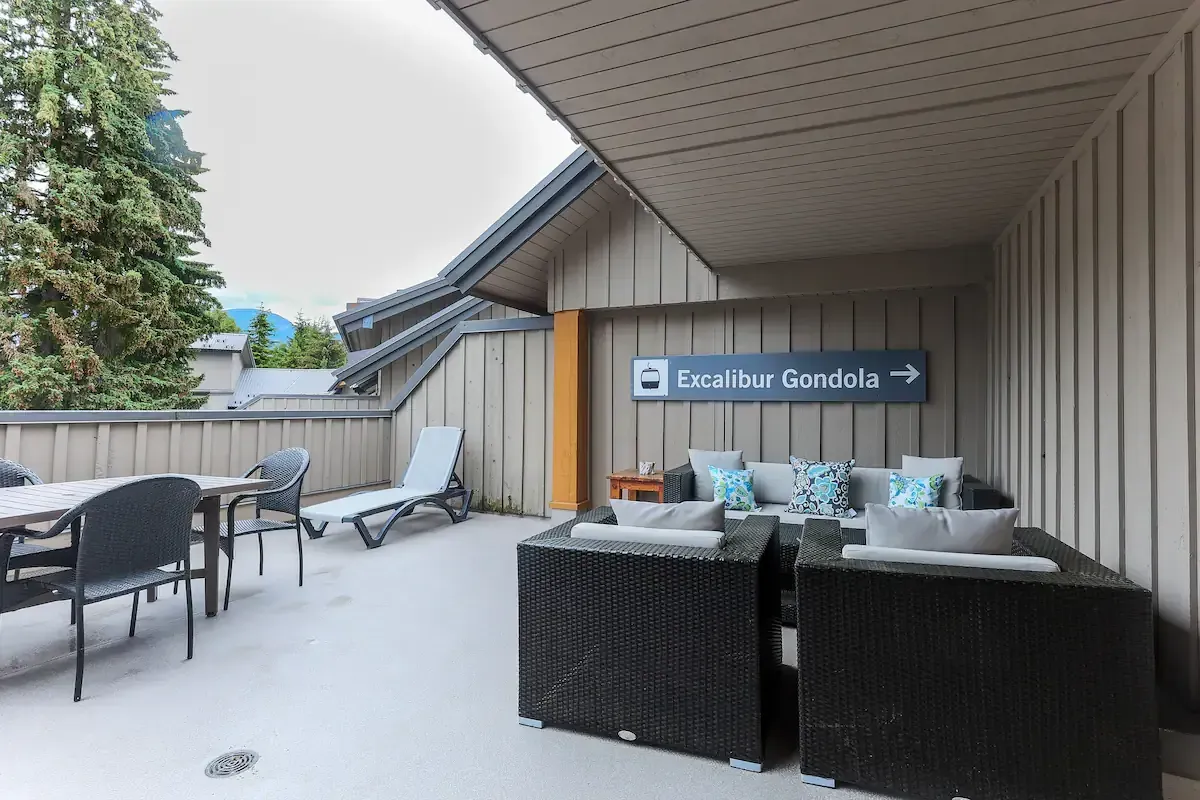 A patio with furniture and a sign that says snowflake gondola
